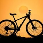 a-bicycle-is-silhouetted-against-the-sunset-photo